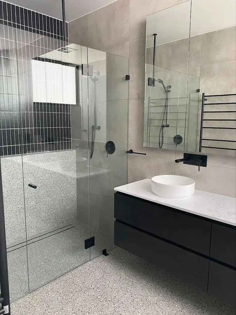 Renovated bathroom with frameless shower screen and floating vanity