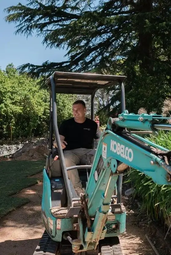 Steven Seery operating a mini excavator on a drainage job